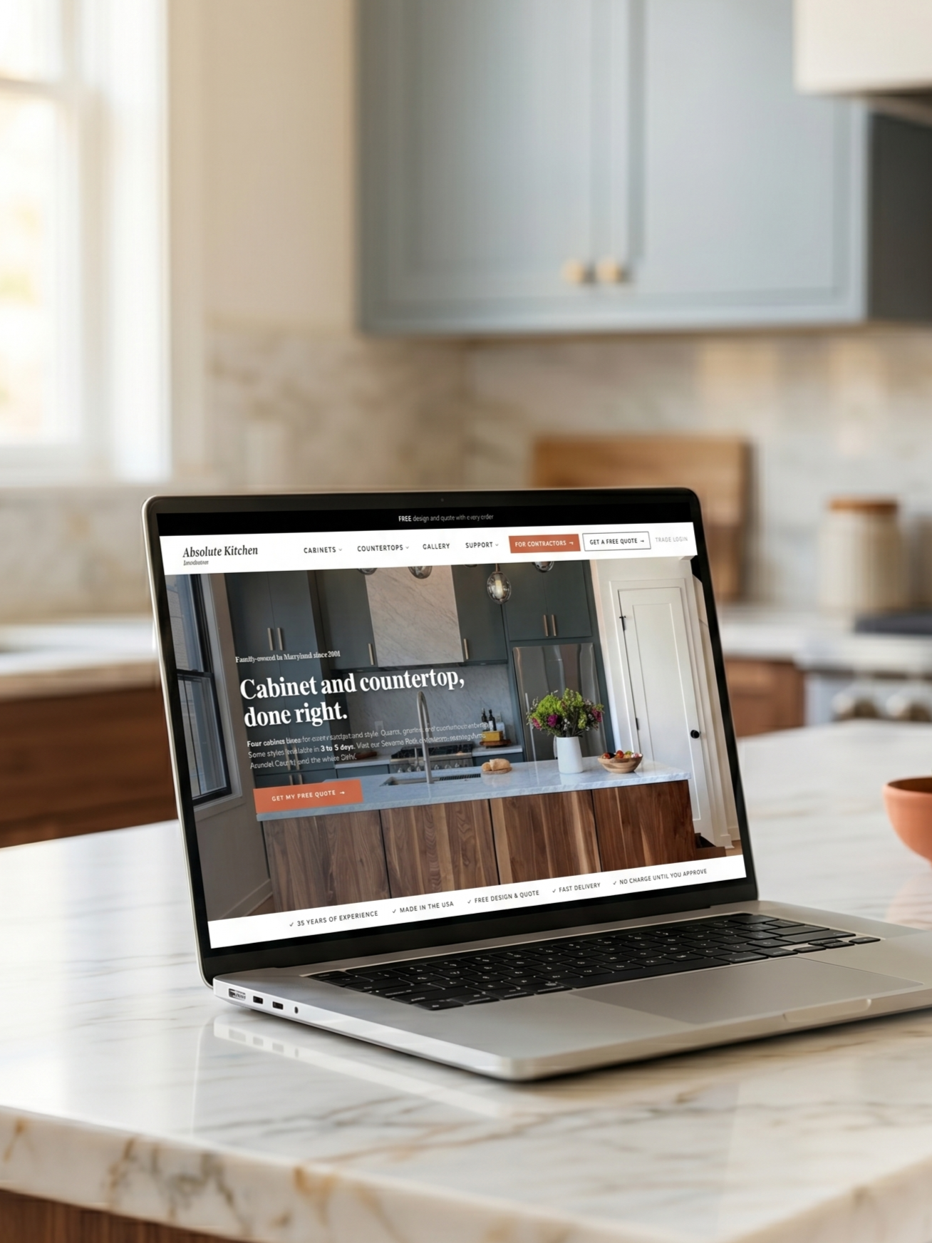 Absolute Kitchen Distributors website homepage on a laptop, designed by Kitchen Websites